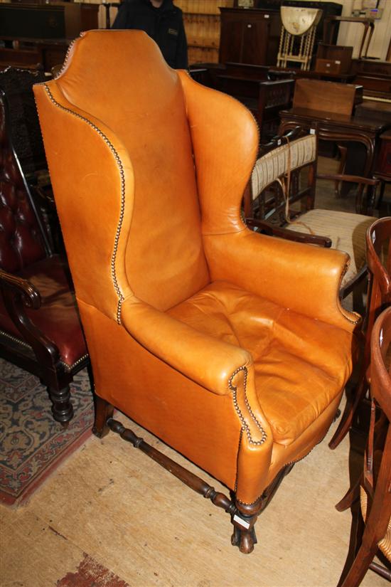 High wing back tan leather chair